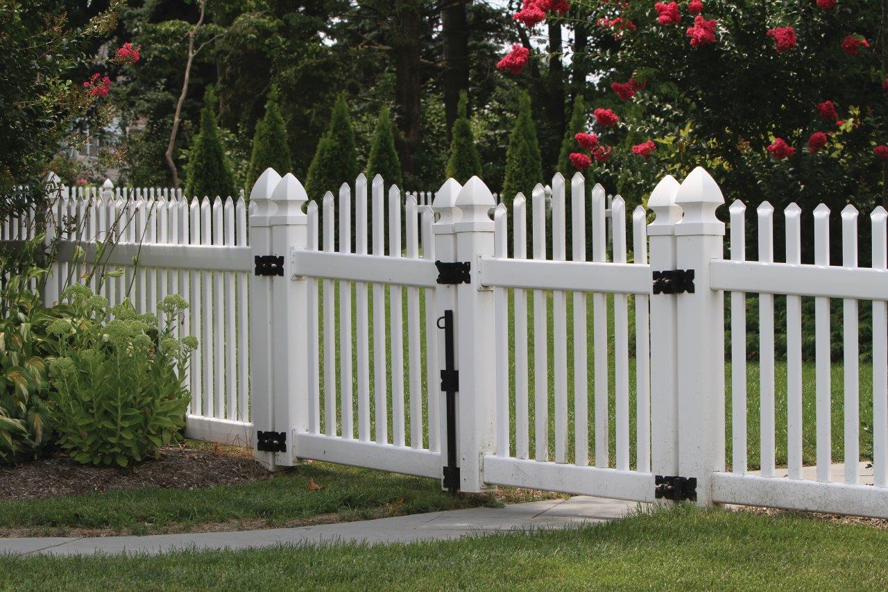 White vinyl fence with vinyl post caps